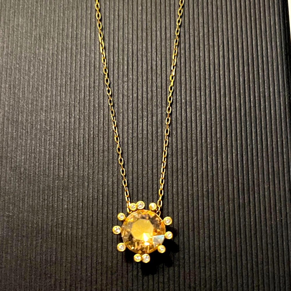 Swarovski Olive collection necklace with golden yellow crystal.